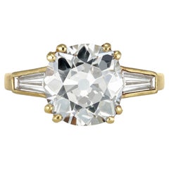 Anello solitario affiancato da un diamante Old Mine.