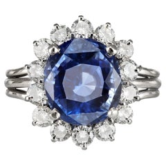 Vintage Ceylon sapphire and diamond cluster ring, mid 20th Century.