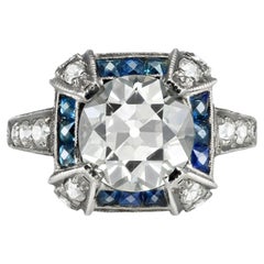 3.13 carat Old cut diamond and sapphire cluster ring, early 20th Century.