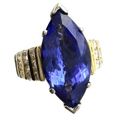 Anillo solitario de tanzanita marquesa AAA de 8 ct y diamante de canal de 1,00 ct