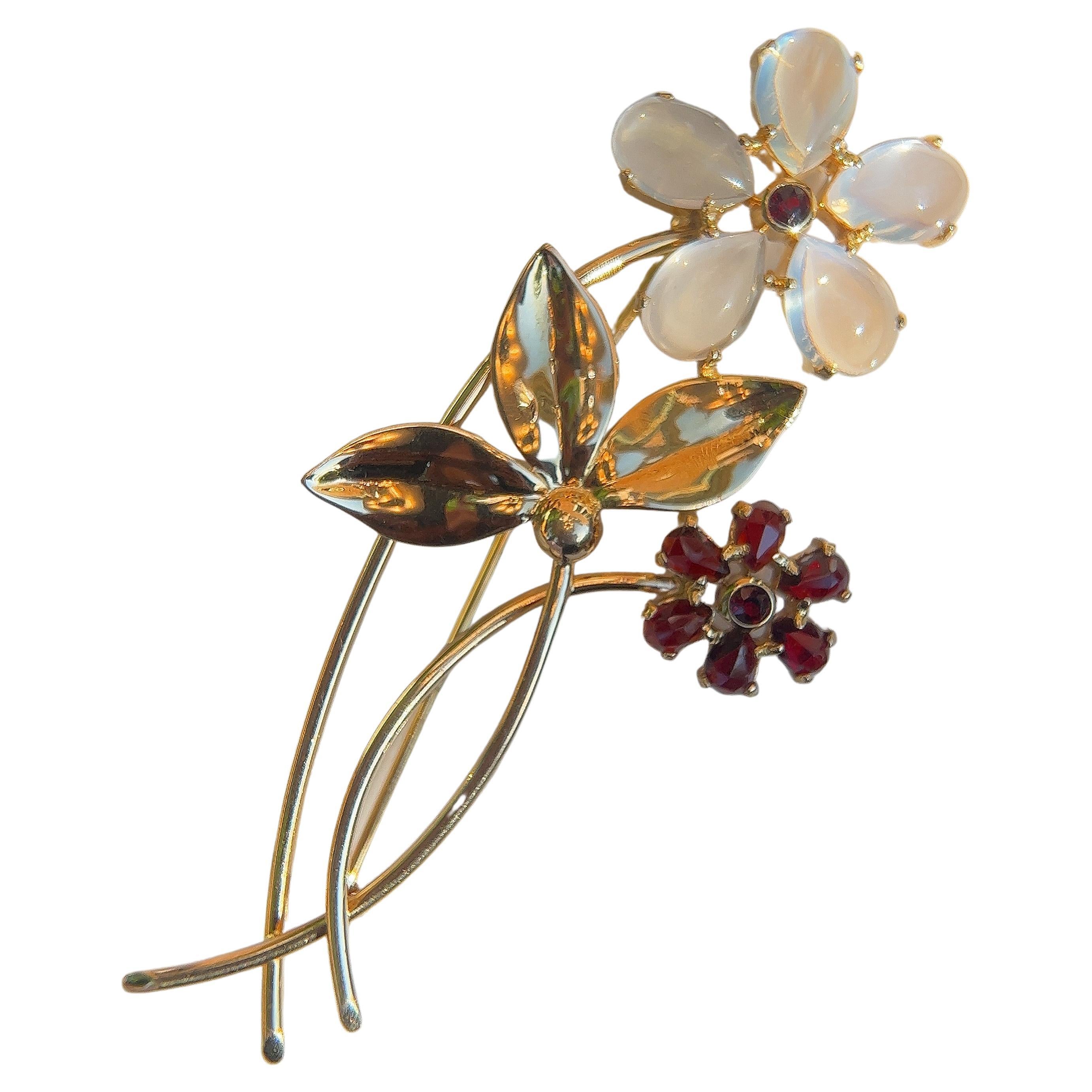 Tiffany & Co. Moonstone and Garnet Flower Pin. 1940s.