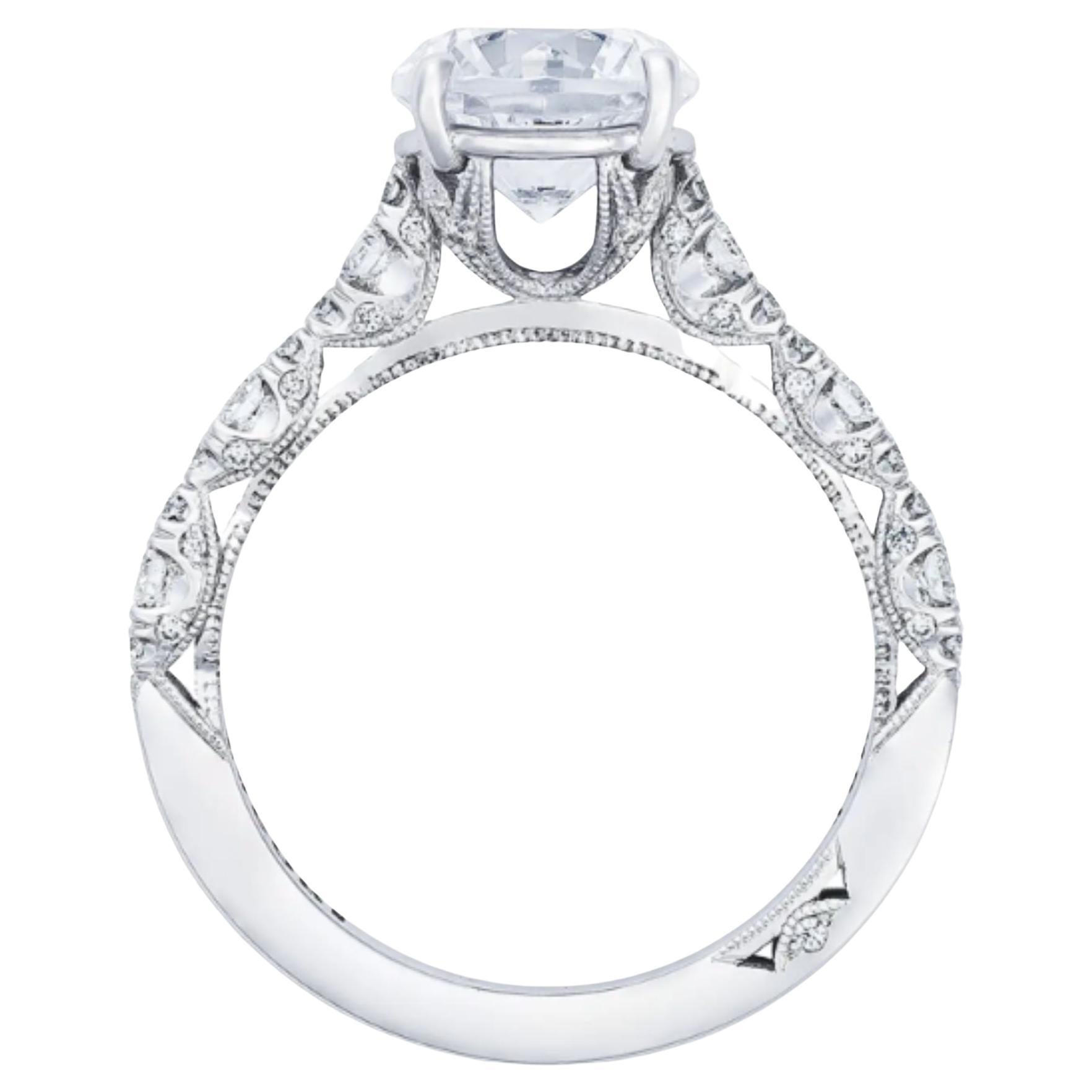 Beautiful marquise shapes with brilliant graduating diamonds dance along this stunning engagement ring. The diamonds are placed in a French-cut setting, allowing more diamond brilliance from every angle to bring light to the round center. The