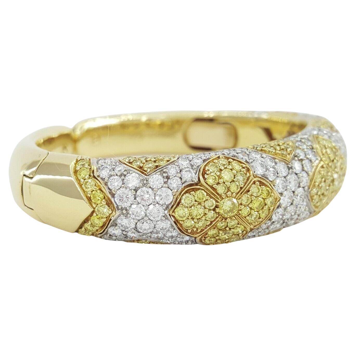 Bvlgari 10.69 ct Yellow & White Diamond 18k Yellow Gold Cuff Bangle. 

The bracelet weighs 60.5 grams. The measurements of the bracelet are 6.25