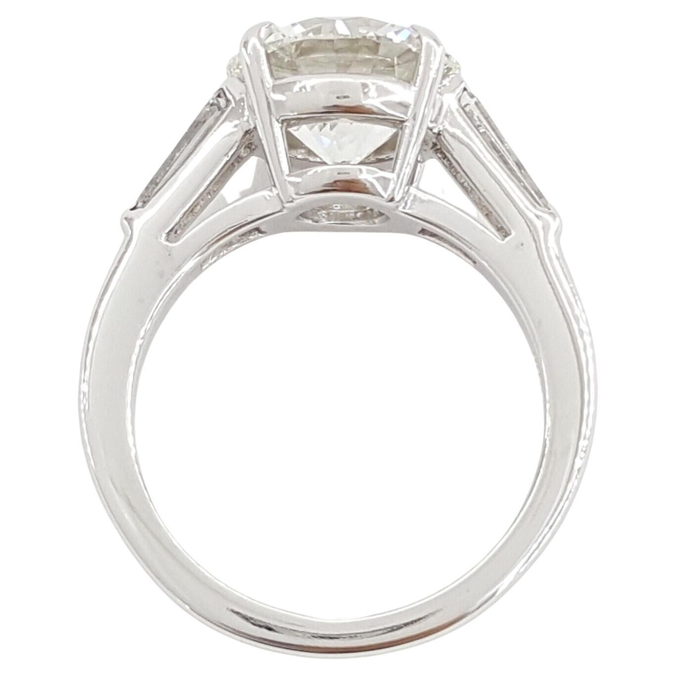 Tiffany & Co. 3.33 Carat Platinum Round Brilliant Cut Diamond Three Stone Engagement Ring. 



The ring weighs 7.9 grams, size 5.5, the center is a Natural Round Brilliant Cut diamond weighing 3.33 ct, I in Color, VS1 in Clarity w/ Specifications: