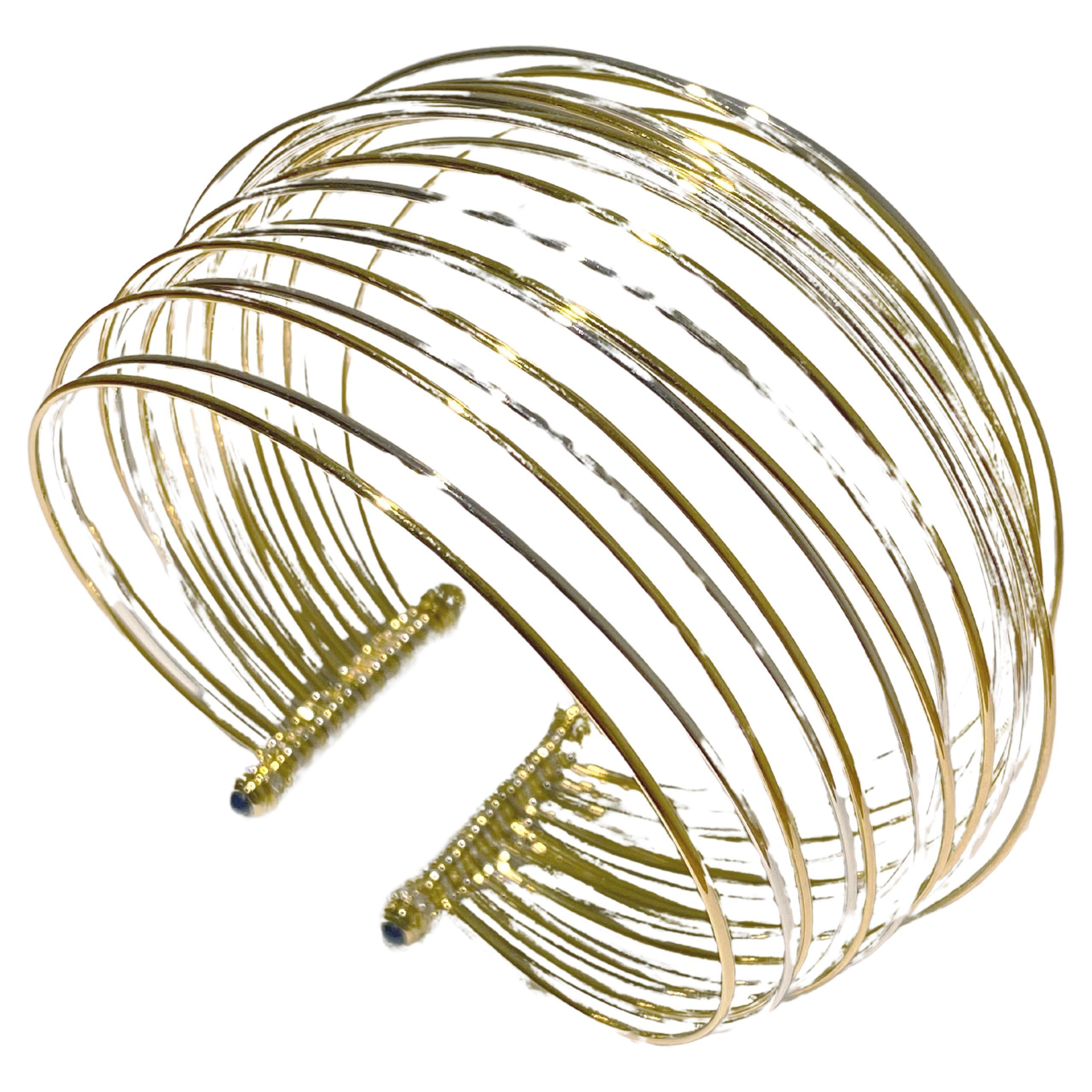 Introducing a masterpiece from the renowned Italian jeweler, Scavia, behold a captivating creation that epitomizes elegance and innovation. This piece is a mesmerizing composition of elastic white and yellow gold threads, meticulously woven to form