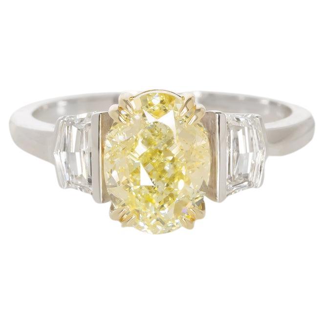 GIA Certified 2 Carat Oval Cut Fancy Yellow Diamond  White and Yellow Gold Ring