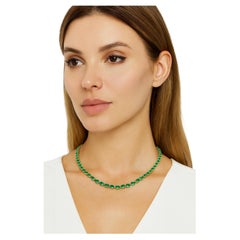 23 Carat Colombian Emerald Tennis Necklace  Crafted in solid 18K yellow gold