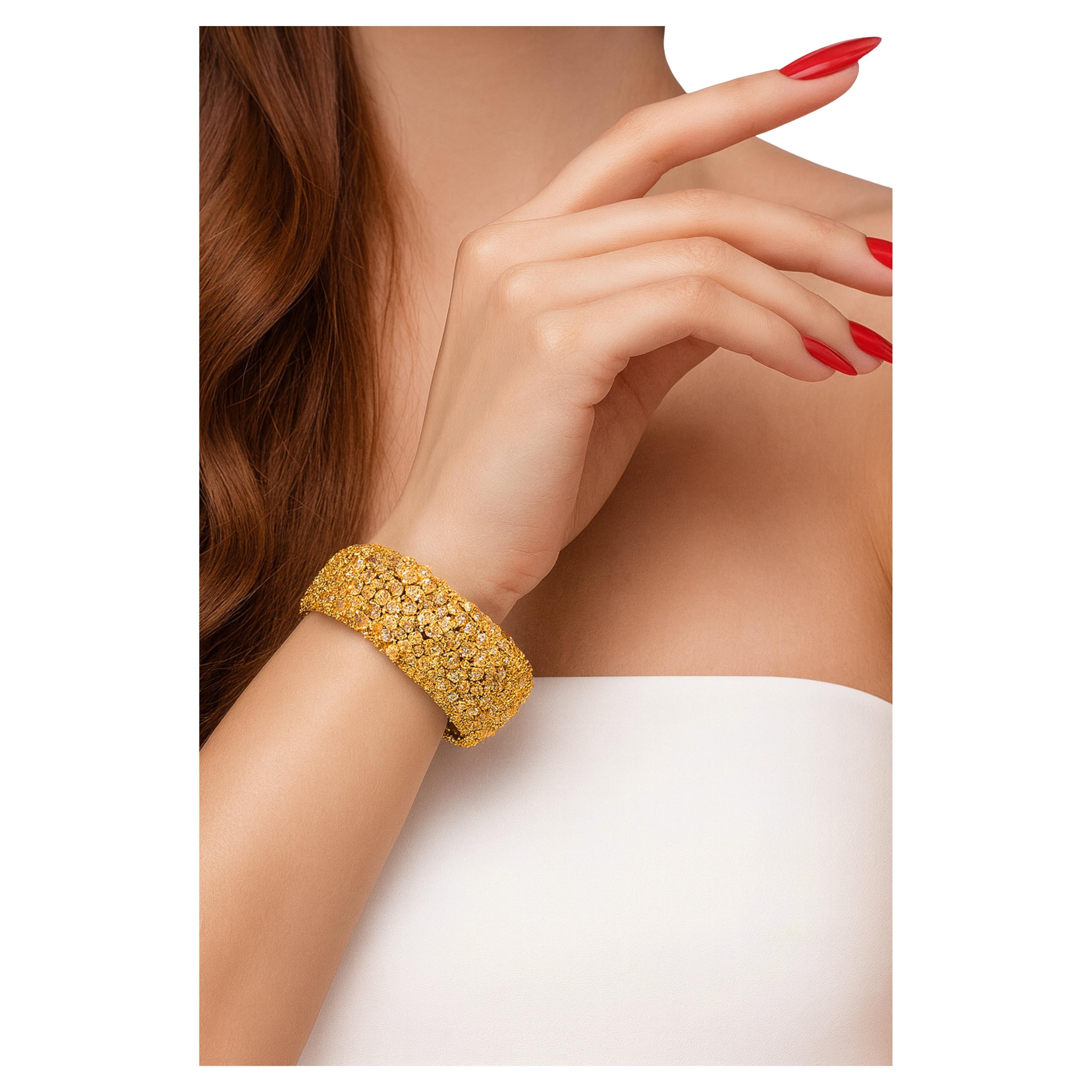 Fine Natural Fancy Yellow Canary Multi-Shape Diamond Cluster Wide Lady’s Bracelet

This extraordinary bracelet is crafted in solid 14K yellow gold and showcases a dazzling 48 carats total weight of natural diamonds. Designed in a bold wide carpet