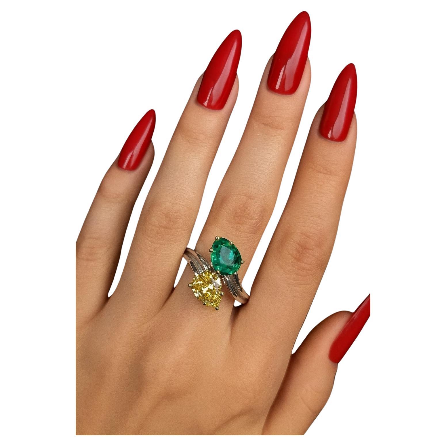 Harry Winston 2,69 Karat kolumbianischen Smaragd & Fancy Vivid Yellow Diamond Platinum Ring - GIA zertifiziert

Präsentiert wird ein außergewöhnlicher Platinring von Harry Winston mit einem leuchtend grünen kolumbianischen Smaragd und einem Paar