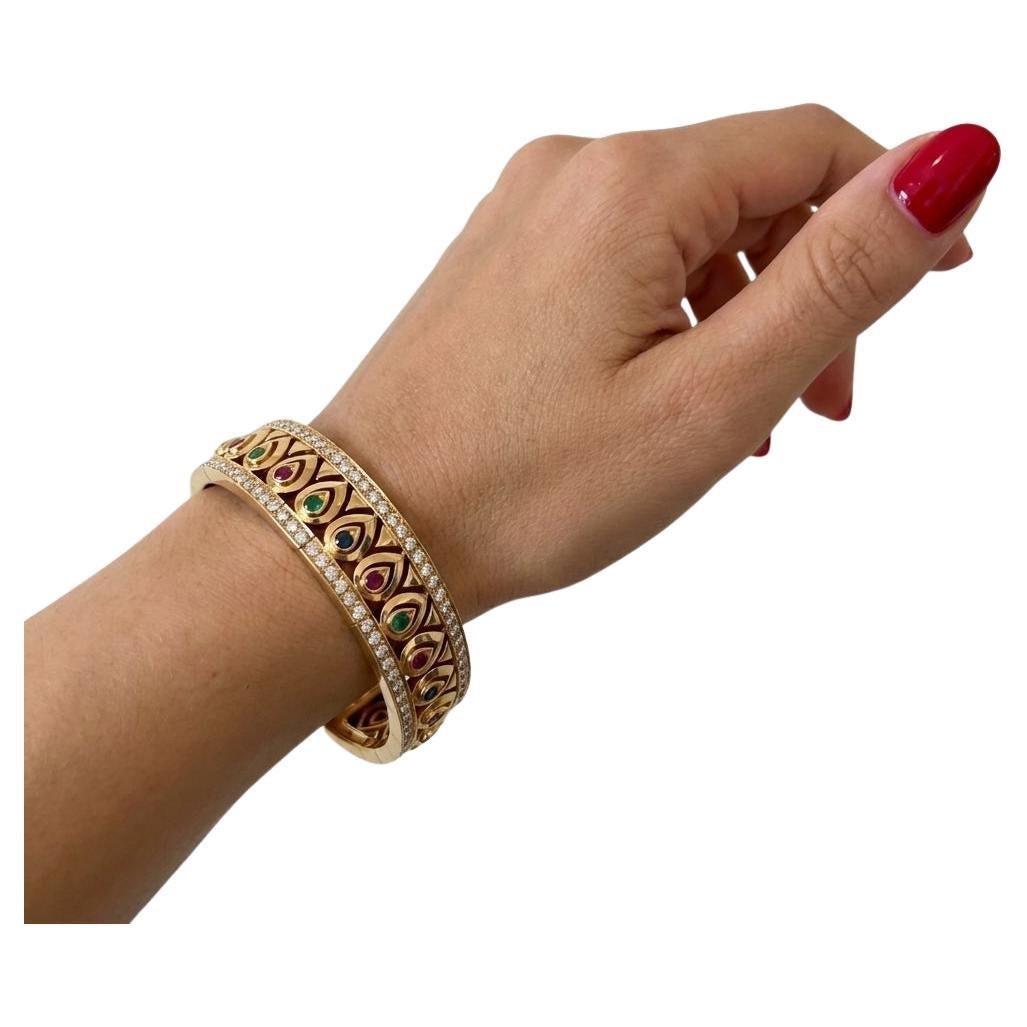 Cartier 13 Carat Rubies Emerald Blue Sapphire 18K Yellow Gold Bangle Bracelet For Sale