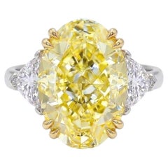 GIA Certified 6.34 Carat Oval Cut Fancy Yellow Diamond with Trillion Ring