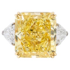GIA Certified 10 Carat Fancy Yellow Diamond Ring with Trillion Side Stones