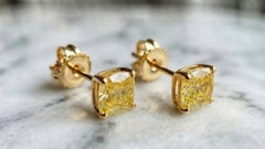 GIA Certified 4.03 Carat Fancy Yellow Cushion-Cut Diamond Stud Earrings