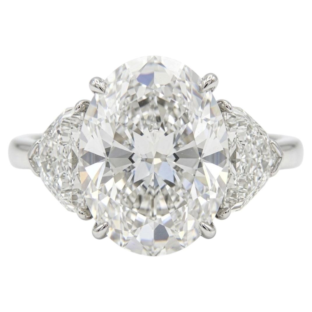 GIA Certified 4.01 Carat Oval Cut VVS2 Clarity Diamond Three Stone Platinum Ring For Sale