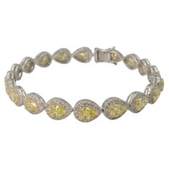 Tennisarmband mit einem 12,9-Karat-Fancy-Yellow-Diamanten und weißen Diamanten
