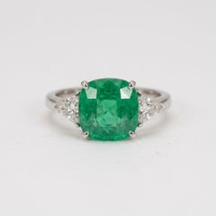 5.34 Carat Vivid Green Colombian Emerald Diamond Three-Stone Ring