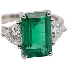 7.63 Carat Colombian Natural Emerald and Diamond Three Stone Platinum Ring