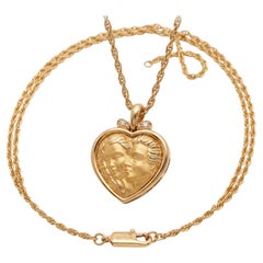 Collana con ciondolo a forma di cuore “Adamo ed Eva” in oro giallo 18 carati della linea Sculptural di Carrera y Carrera