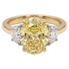 Bague en or jaune et blanc sertie d'un diamant ovale jaune « Fancy Yellow » de 2 carats, pureté VVS1