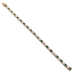 Bracciale tennis firmato KK con diamanti da 10 carati e smeraldi, in oro giallo 18 carati