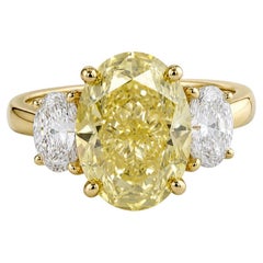 GIA Certified 4 Ct. Fancy Light Yellow Oval Diamond Yellow Ring