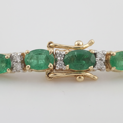 Bracelet tennis en or jaune 14 carats, orné d'un diamant ovale émeraude de 5 carats