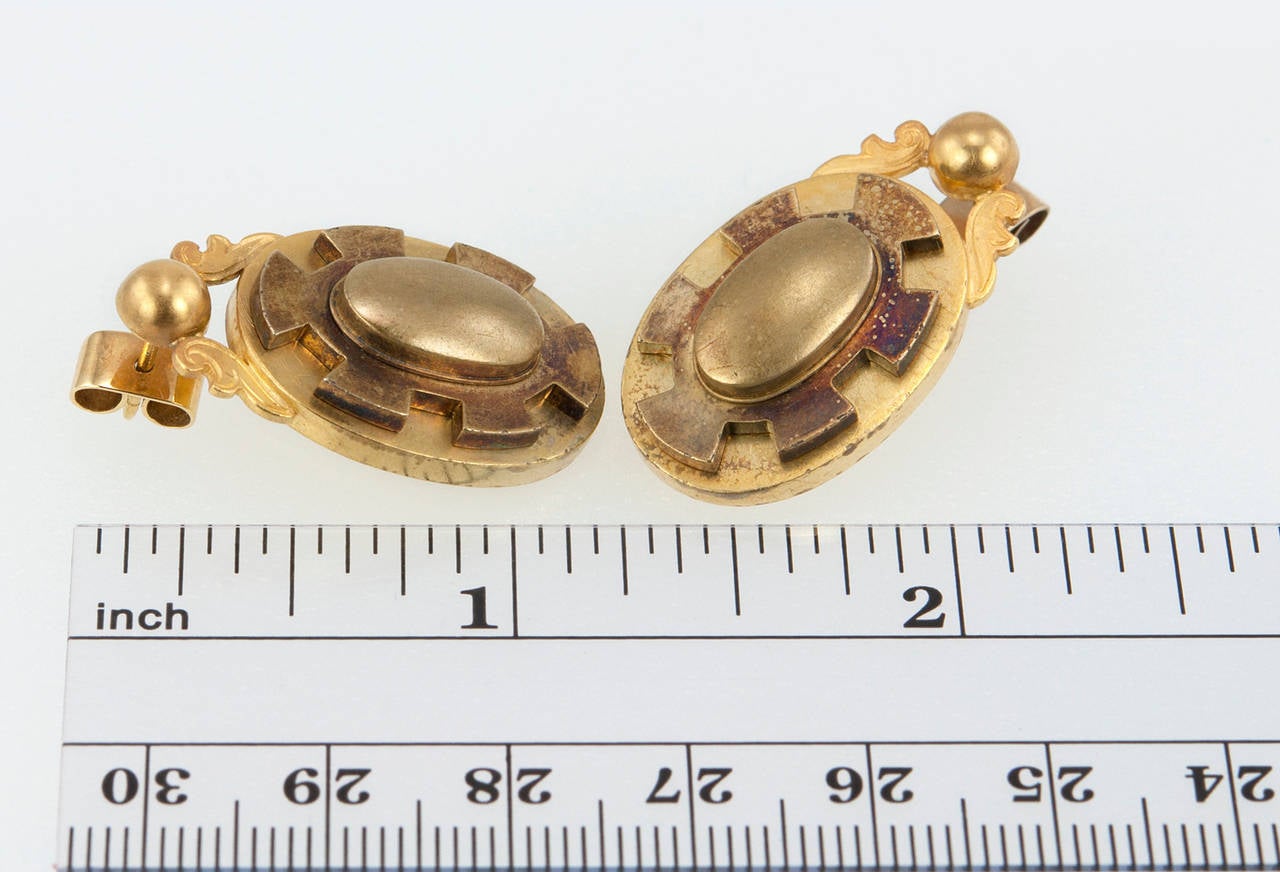 Victorian oval drop earrings with a wonderful patina! The earrings are made of 18 karat yellow gold and date back to circa 1890s. We believe the earring posts were added on to the earrings later on.