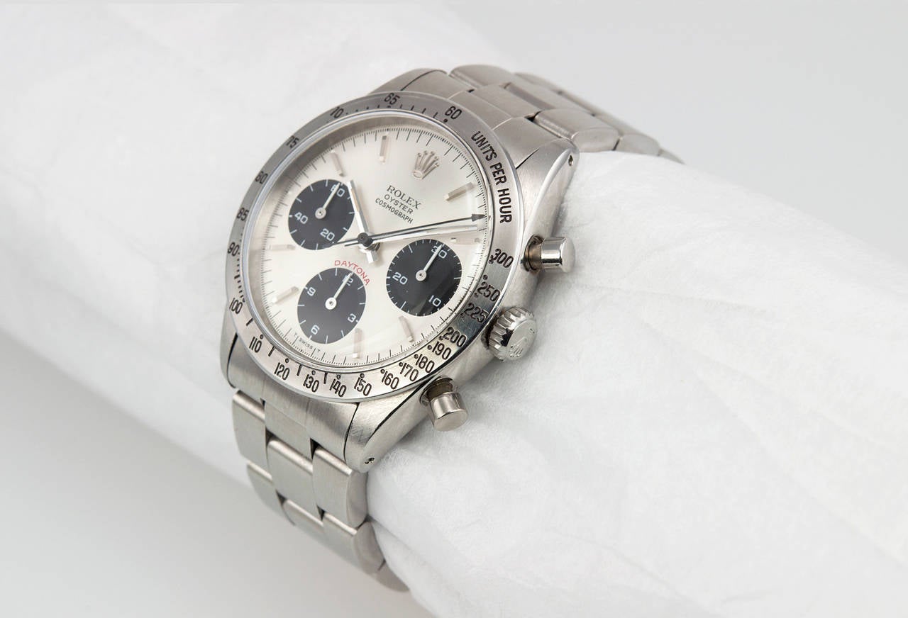 Classic Rolex Daytona stainless steel wristwatch, reference 6239. This super rare collectable watch features a replacement service dial, original steel tachometer bezel, plastic crystal, original steel chronograph buttons, locking waterproof crown,