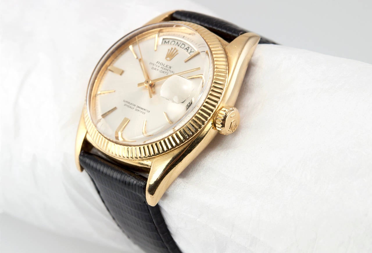 Rolex President wristwatch in 18 karat yellow gold with new black leather strap, reference 6511. This beautiful early man's President watch is very collectible and features the original white day/date dial, locking waterproof crown, plastic crystal,