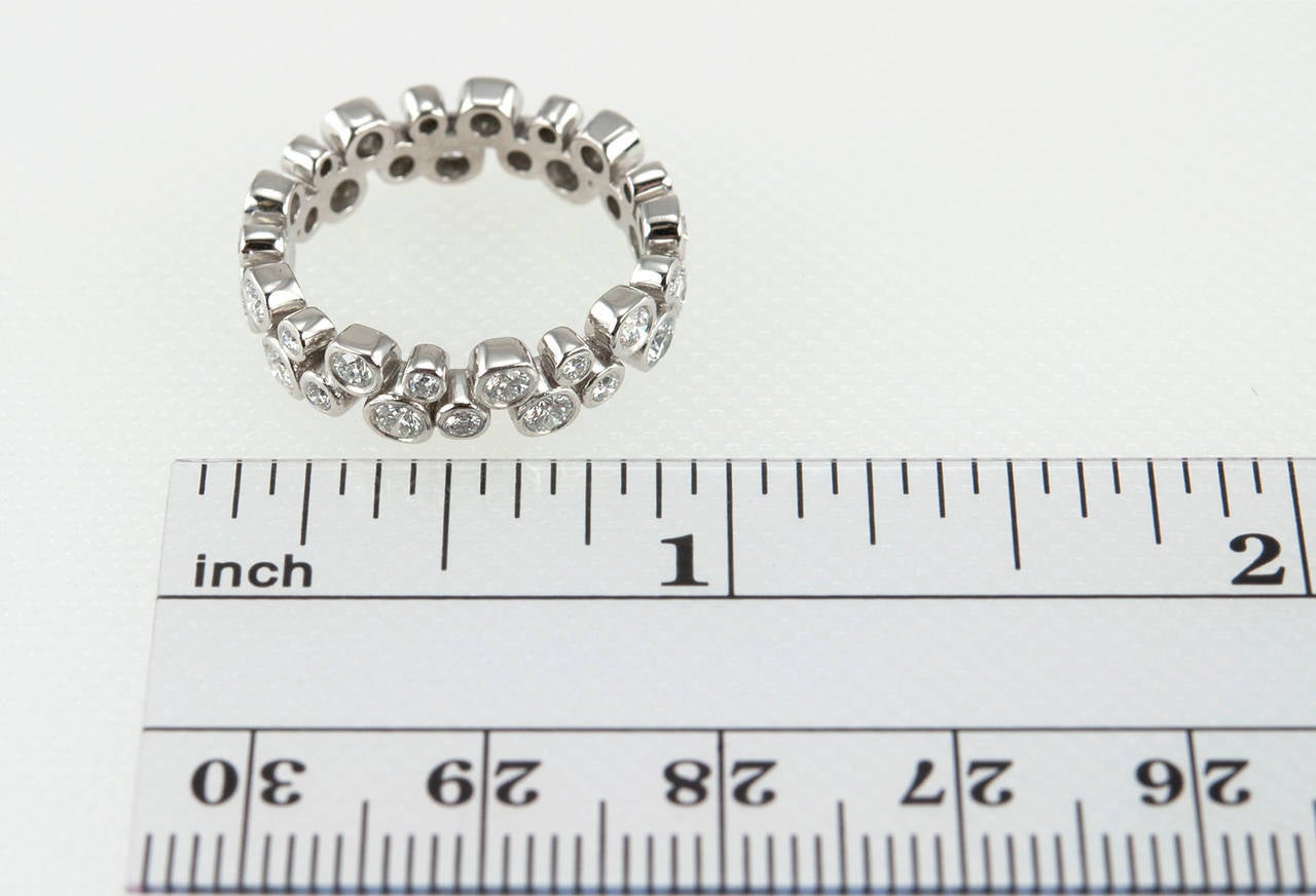 Tiffany & Co. Bubbles band eternity ring with round brilliant bezel set diamonds in platinum featuring 0.96 carats of total diamond weight. beautiful and so sparkly! 

Ring measures approximately 5.5 millimeters in width and 3 millimeters in