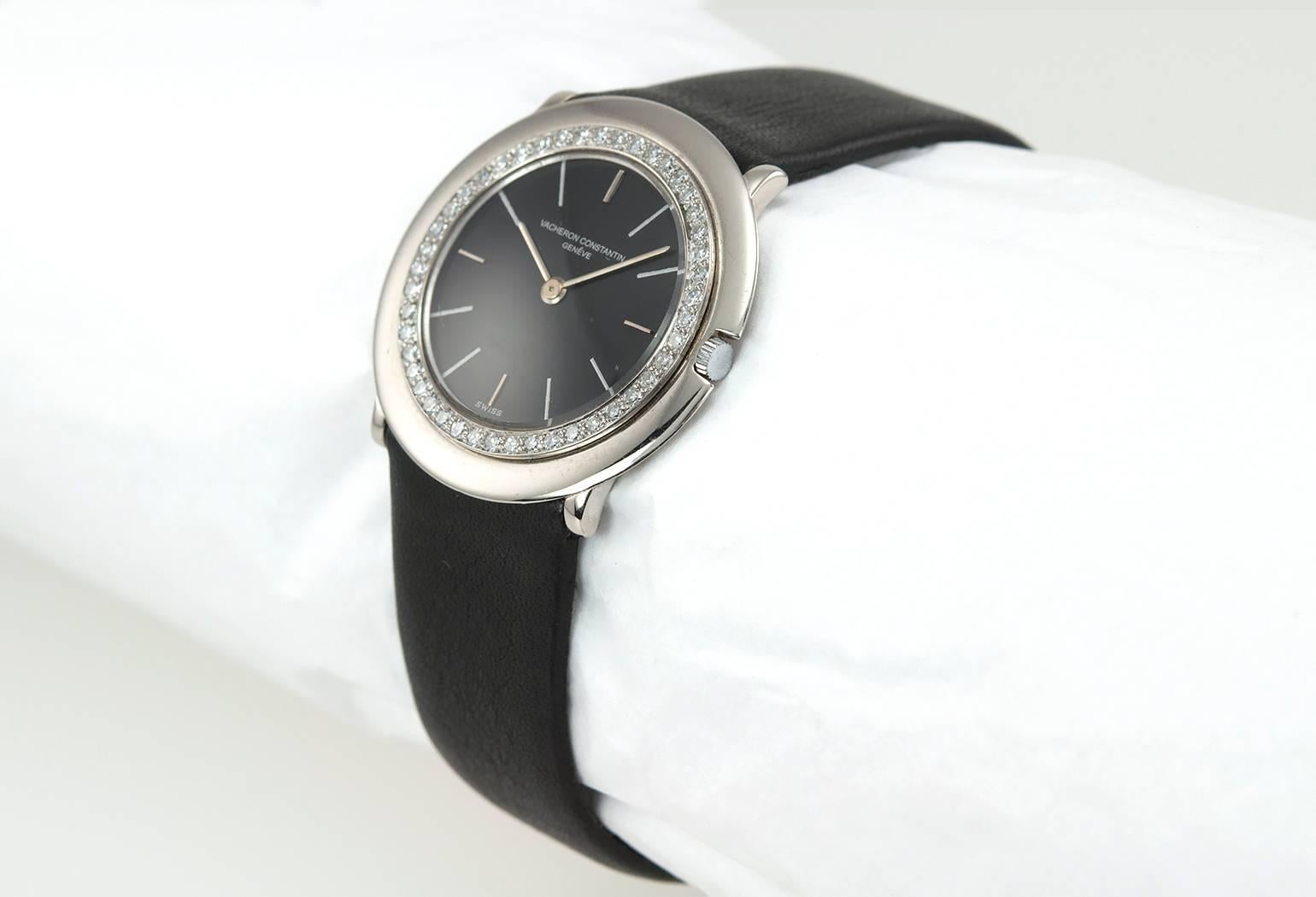 Vacheron & Constantin 18 karat white gold wristwatch, reference 6418. This great watch features a 18k white gold bezel with 46 round brilliant diamonds, a manual wind 17 jewel movement, a black refinished dial with a new black leather strap. Case