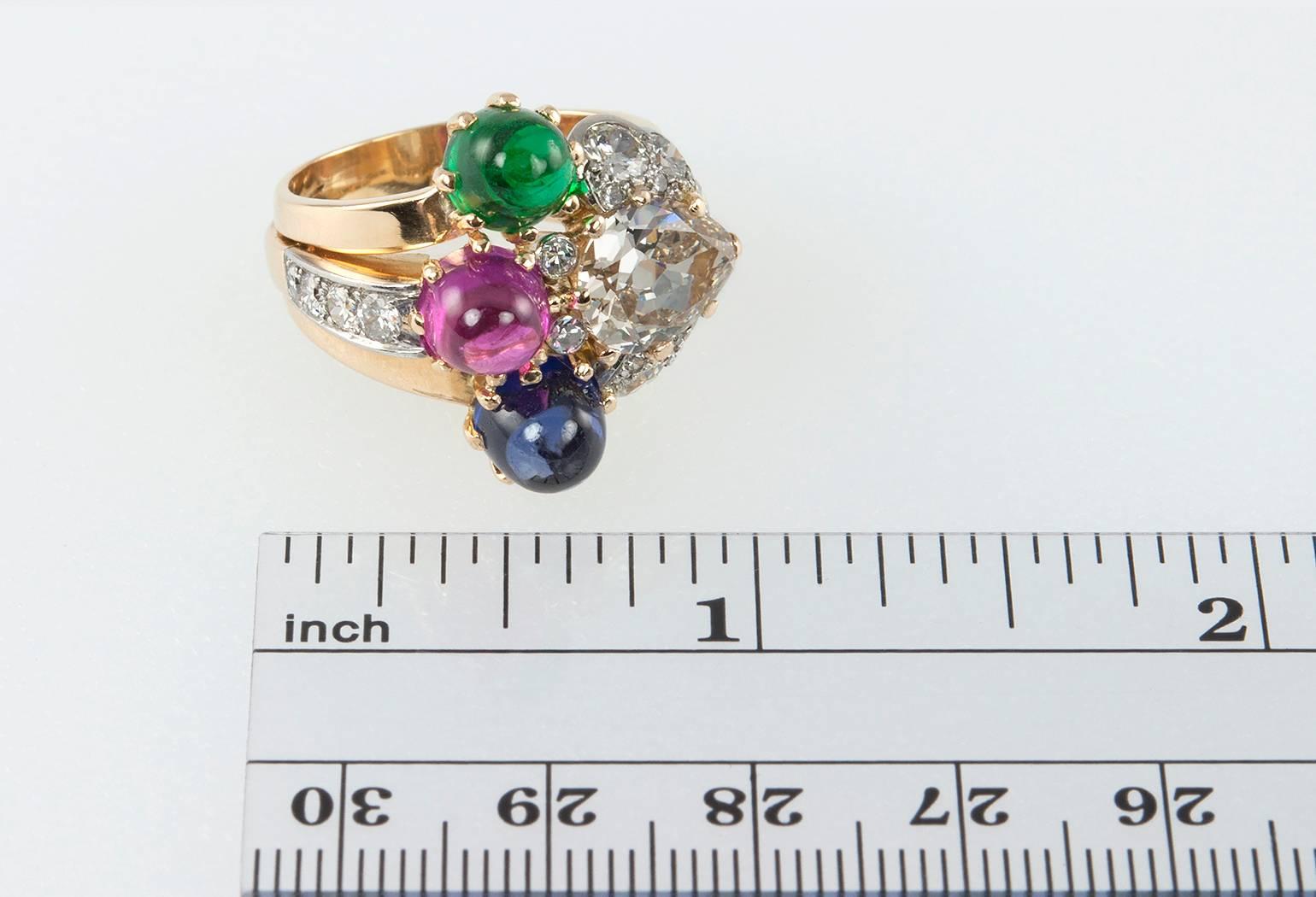 A 1950s retro 18 karat yellow gold ring featuring an Old European Cut pear shaped diamond, approximately 2.02 carats, L-M in color and VS in clarity.  The pear shaped diamond is surrounded by 16 transitional cut round diamonds, approximately 1 carat