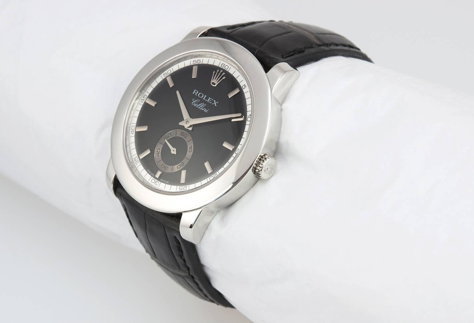 Rolex Cellini platinum wristwatch, reference 5241. This beautiful Rolex features, an original factory black dial, manual wind movement, 38mm platinum case, a black crocodile strap, with a original platinum buckle, circa 2001, serial numbers K68XXXX.