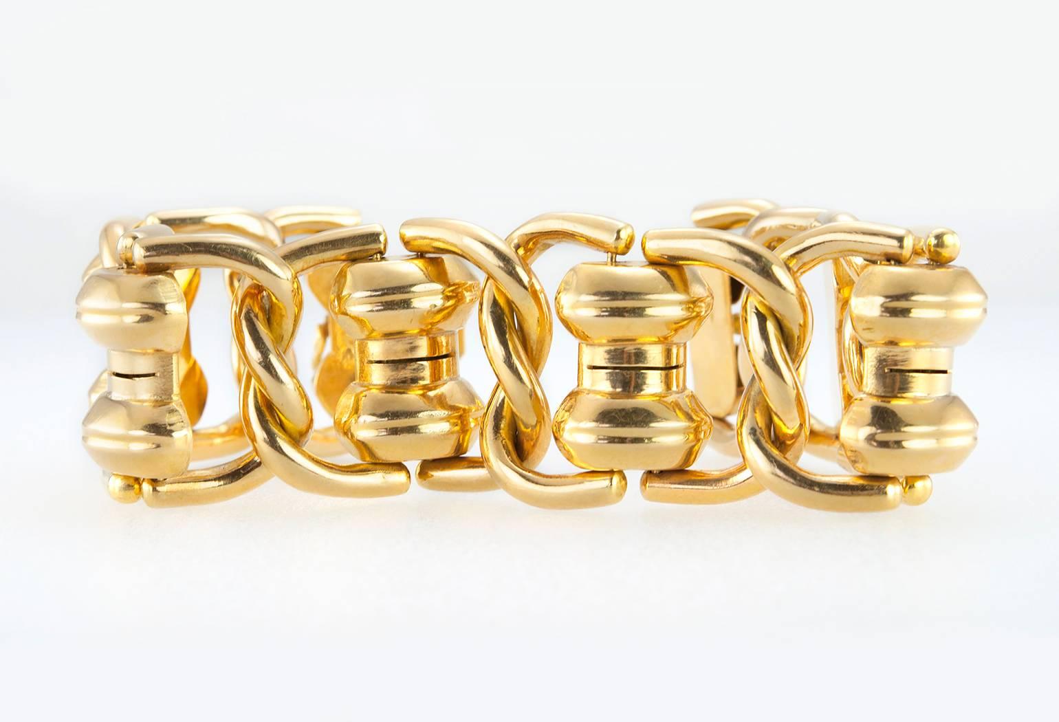A cool, thick and chunky gold link bracelet in 18 karat yellow gold.  This 1960s bracelet has large links and open spaces that looks fabulous on!  

The bracelet measures approximately 7.5 inches in length, 1.20 inches in width, and 0.30 inches in