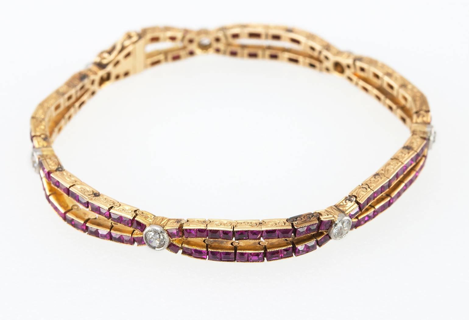 A stunning Edwardian ruby link bracelet in 18 karat yellow gold with platinum topped diamonds from circa 1910.  This truly special bracelet consists of 7 Old European Cut diamonds, approximately 1 carat in total diamond weight, bezel set in platinum