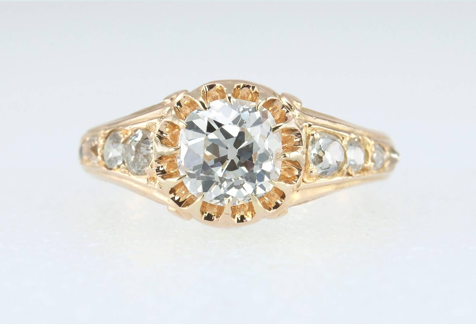 A beautiful Victorian 14 karat yellow gold diamond engagement from circa 1890s-1900.  This special ring features a center 1.00 carat Old Mine Cut diamond that is G in color and VS2 in clarity (per EGL certificate).  Each shoulder of the ring also