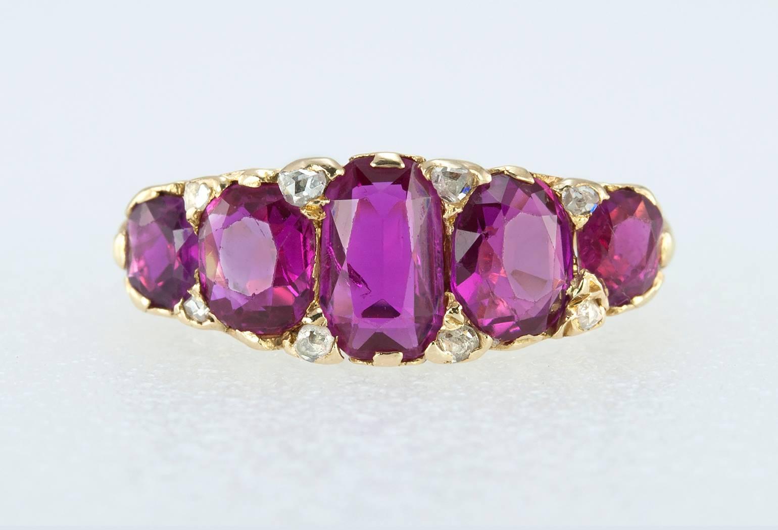 A beautiful Victorian five-stone ruby ring in 18 karat yellow gold.  The rubies are natural, Burmese rubies (per GIA certificate) with a stunning color! In between the rubies, there are 8 rose cut diamonds that give a glimmer of sparkle.  Circa