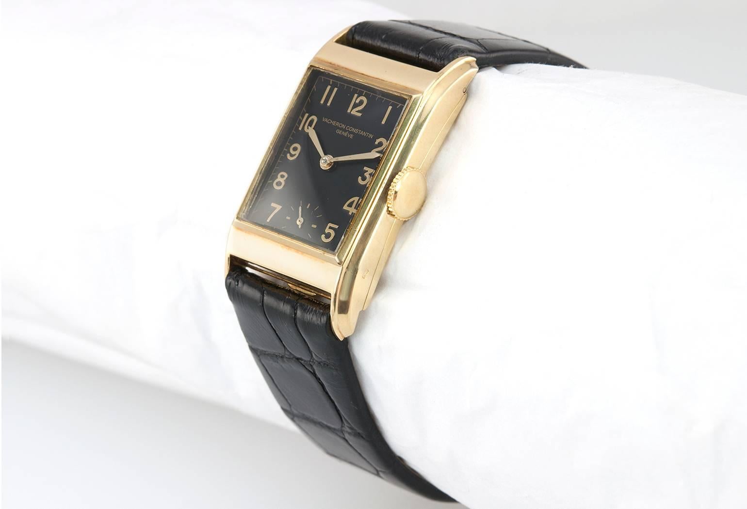 Vacheron & Constantin dress model wristwatch in 18 karat yellow gold, case numbers 264326. This beautiful watch features a V&C signed case, with movement numbers being 421062, a black refinished dial with gold stick roman numerals, an 18 karat