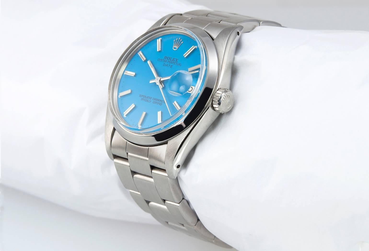Rolex Oyster Date wristwatch in stainless steel, reference 1500.  This very cool Rolex watch features a custom bright blue stick dial, a smooth stainless steel bezel, a stainless steel folded Oyster bracelet, plastic crystal, stainless steel
