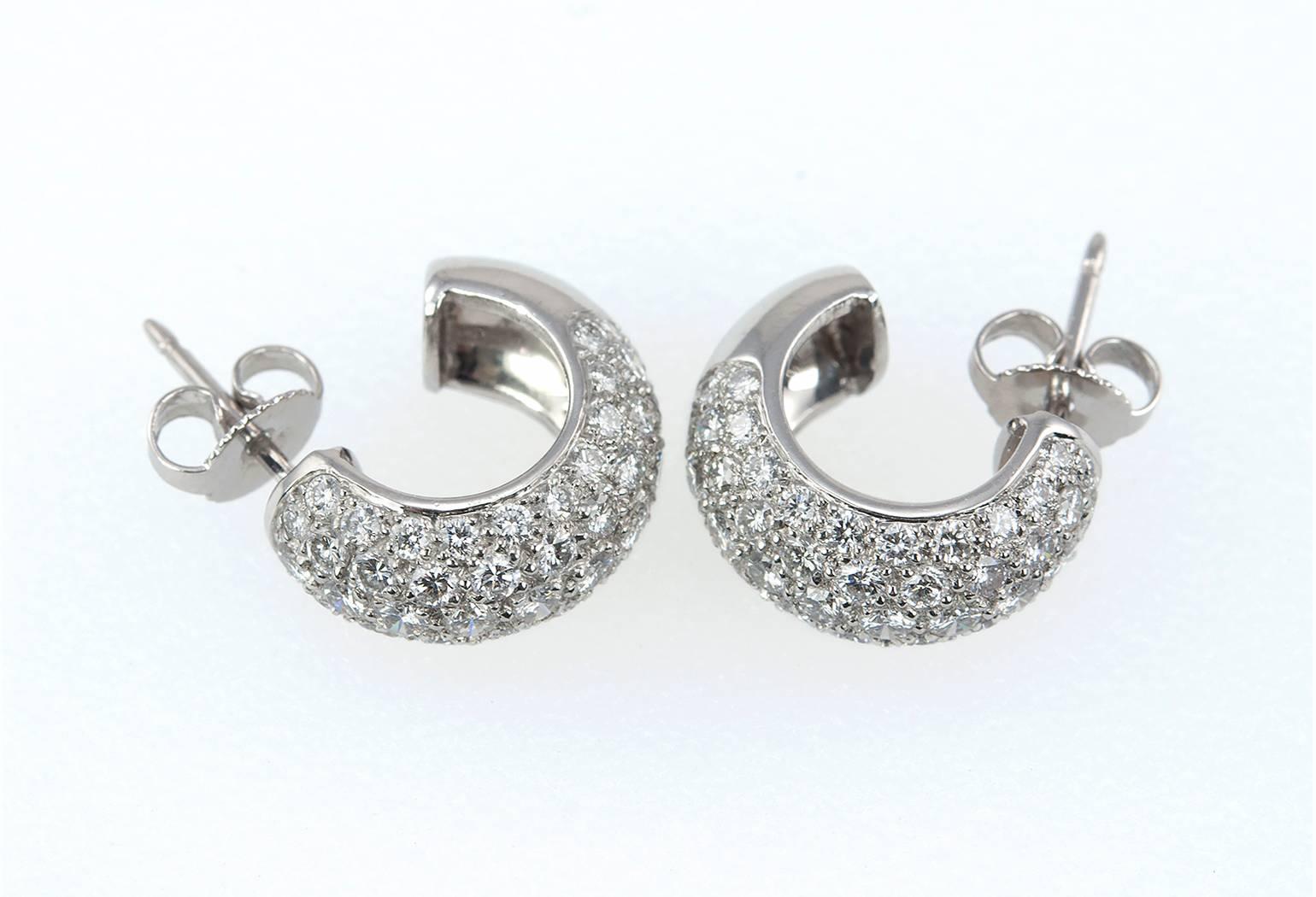 Super sparkly Tiffany & Co. diamond and platinum hoop earrings.  These earrings have 104 round brilliant diamonds bead set in platinum for a total diamond weight of approximately 2.50 carats.  Signed Tiffany & Co, France from circa 2000s.

The