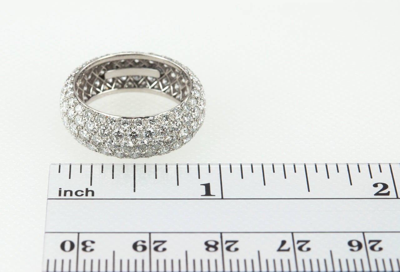 Tiffany & Co. Etoile five-row diamond band ring with round brilliant diamonds pave-set in platinum. The total diamond weight is 3.30 carats. The band measures approximately 7.3 mm in width. Circa 2013.

US size 7 and cannot be sized.