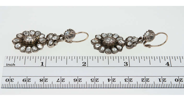 These are so hard to find!  Early Victorian silver topped 14 karat yellow gold dangle earrings set with beautiful rose cut diamonds. The earrings measure approximately 1.62 inches long and 0.73 inches in width. Circa 1850s.

Matching necklace and
