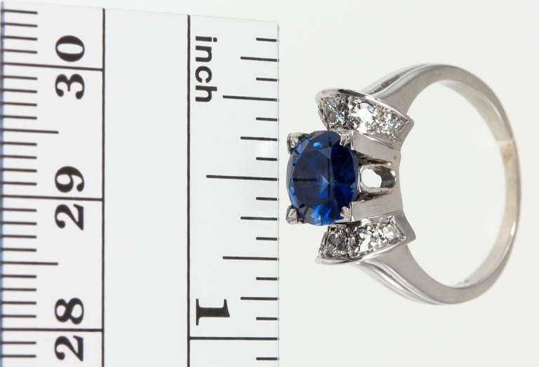 This would be a wonderful engagement ring!  The sapphire is 1.91ct Natural unheated sapphire (GIA certificate).  10 diamonds are set into the platinum mounting.  The ring is size 5 3/4 and can easily be altered.  

I wouldn't mind it as a birthday
