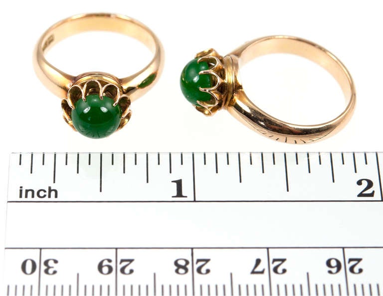 The more the merrier is the motto for this pair of jade rings set in 18 karat gold. The jade is cut en cabochon in a delicate scalloped collet setting. They look great stacked on top of each other. Circa 1920s. Size 5 and can be easily adjusted.