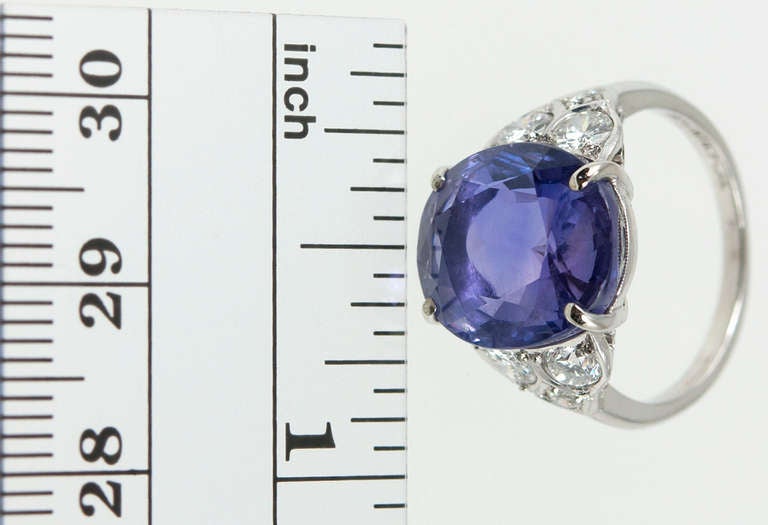 One sapphire ring with double the beauty! This Art Deco ring features a beautiful 9.82 carat color change sapphire stone (GIA) that changes from purple to blue. Additionally, the elegant platinum mounting features 3 round brilliant cut diamonds on