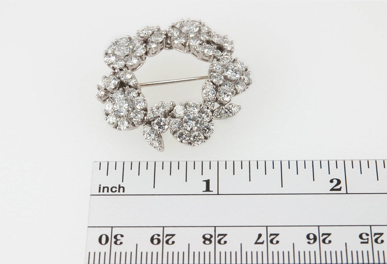 This gorgeous Tiffany & Co. platinum brooch is designed in a circular floral motif and contains 71 round brilliant diamonds, which total approximately 6 carats of diamonds. The brooch is approximately 1.27 inches in diameter and sparkles so bright!