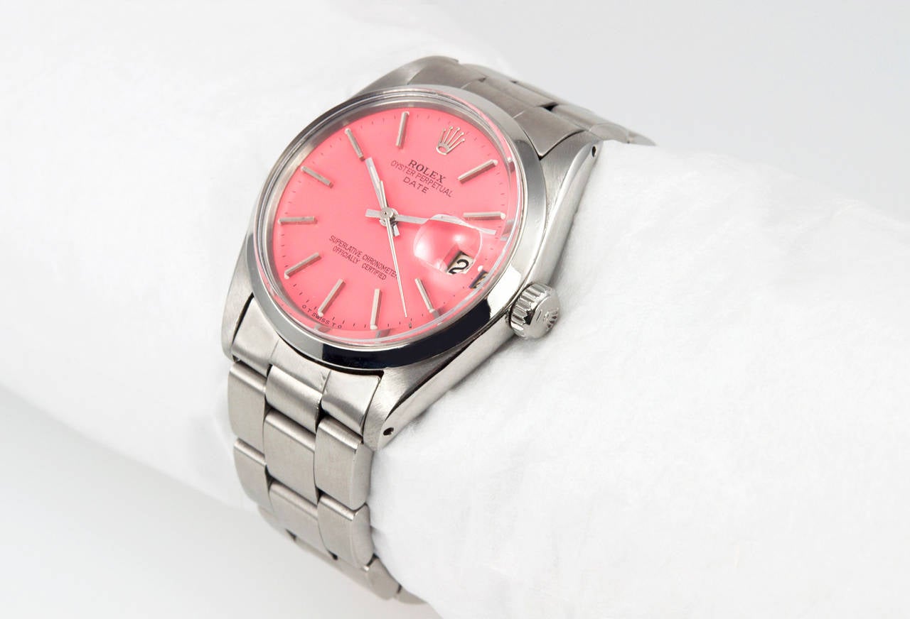 Rolex Date steel wristwatch, reference 1500. This 1968 Date model Rolex l features a custom pink dial, a plastic crystal, a stainless steel locking waterproof crown, and heavy oyster band bracelet. The case measures approximately 34 mm in