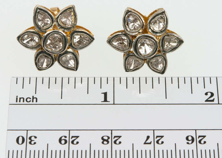 These diamond earrings were created in an Indian Mogul-style design with rose cut diamonds measuring approximately 20mm in diameter in 15 karat gold topped with silver. These studs are so easy to wear that you will never have to take them off!