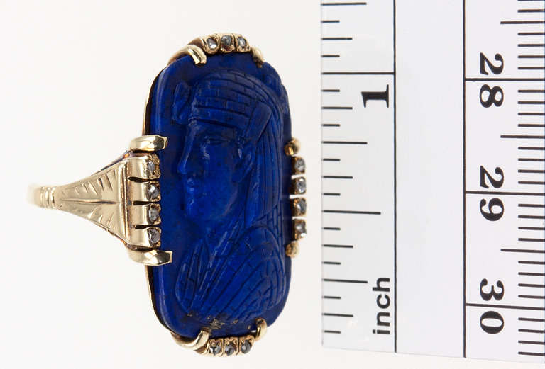 Egyptomania is here to stay! Egyptian Pharaoh's profile carved in lapis lazuli and surrounded by 14 rose cut diamonds set in 14 karat gold, circa 1900.
Currently a size 5.5 but easily altered.