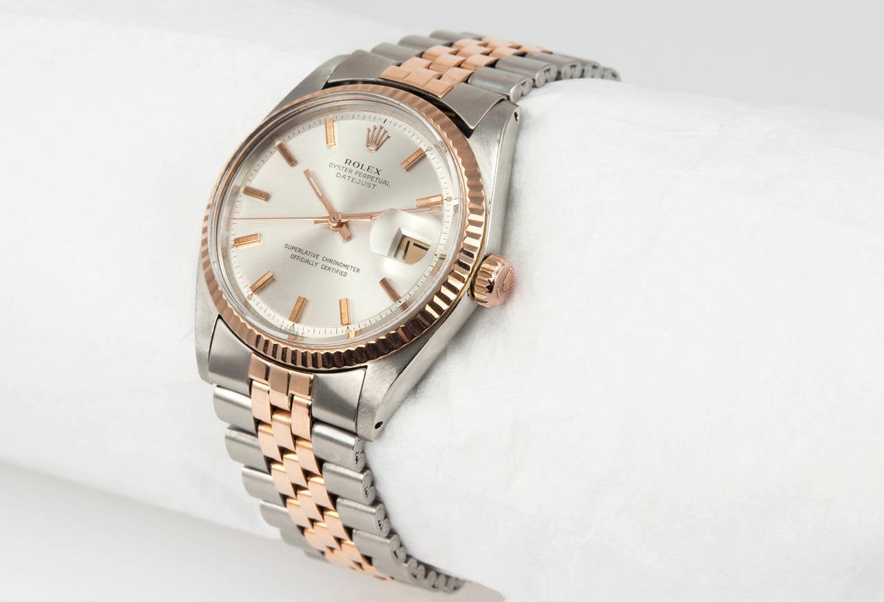 Rolex DateJust 2-Tone wristwatch, reference 1601. This rare early stainless steel and 14 karat pink gold DateJust has and an original satin color dial with straight pink gold baton markers, plastic crystal, locking waterproof pink gold crystal, and